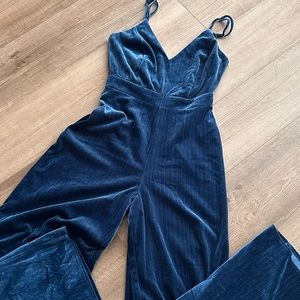 Never worn. Super cute jumpsuit. Darker blue in color and lined.